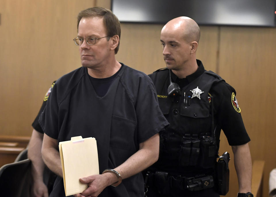 Mark Jensen makes his way into the courtroom for his sentencing hearing, Friday, April 14, 2023, in Kenosha, Wis. The Wisconsin Supreme Court ruled in 2021 that Jensen deserved a new trial in the 1998 death of his wife Julie Jensen, who was poisoned with antifreeze. (Sean Krajacic/The Kenosha News via AP, Pool)