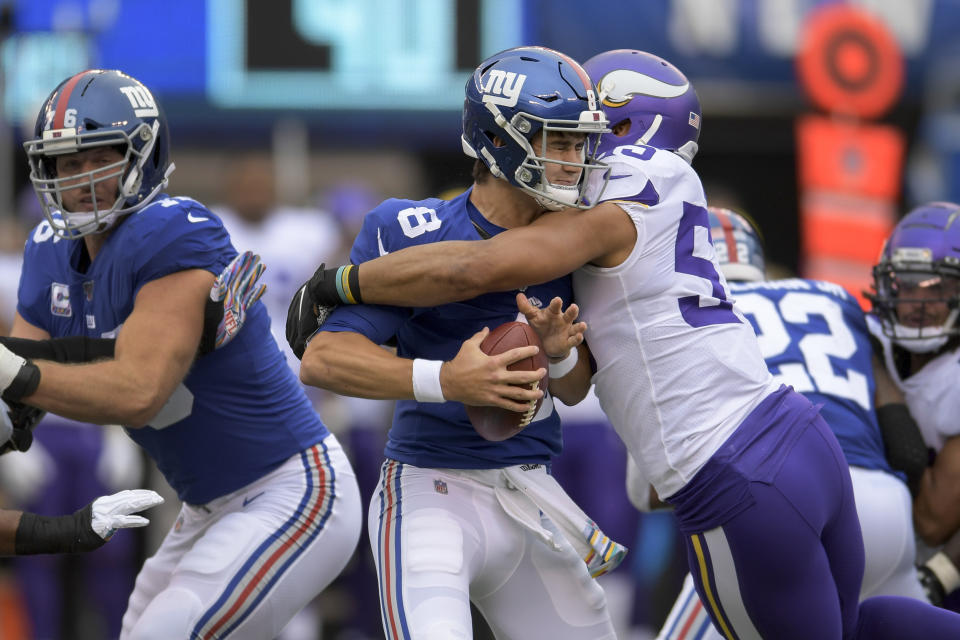 New York Giants quarterback Daniel Jones (8) is sacked by Minnesota Vikings outside linebacker Anthony Barr during the first quarter of an NFL football game, Sunday, Oct. 6, 2019, in East Rutherford, N.J. (AP Photo/Bill Kostroun)