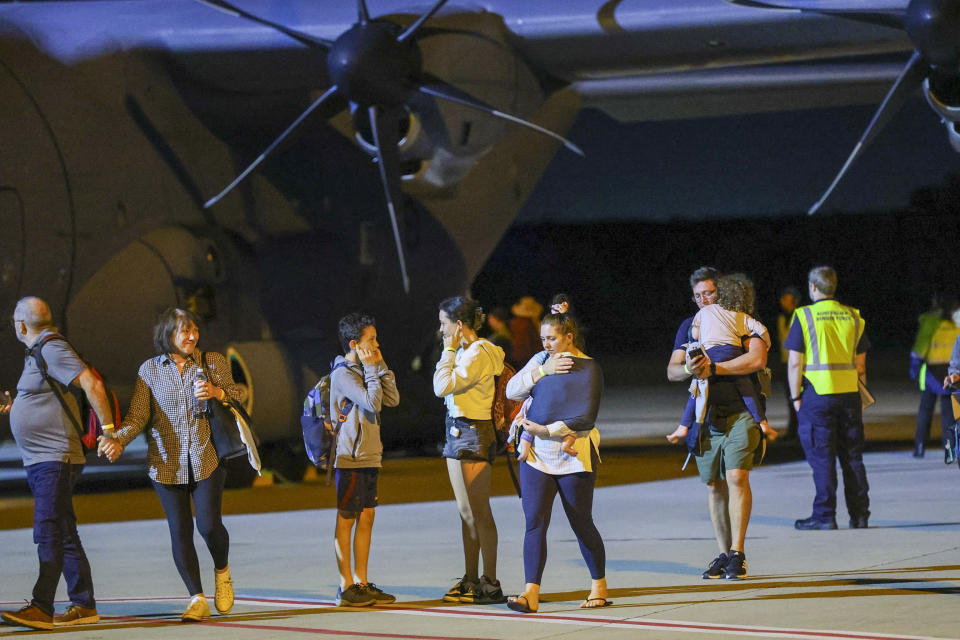 Repatriated Australian travelers arrive from New Caledonia to Brisbane International Airport, in Brisbane, Australia, Tuesday, May 21, 2024. Australia and New Zealand have sent airplanes to New Caledonia to begin bringing home stranded citizens from the violence-wracked French South Pacific territory. (David Clark/Courier Mail/AAP via AP)