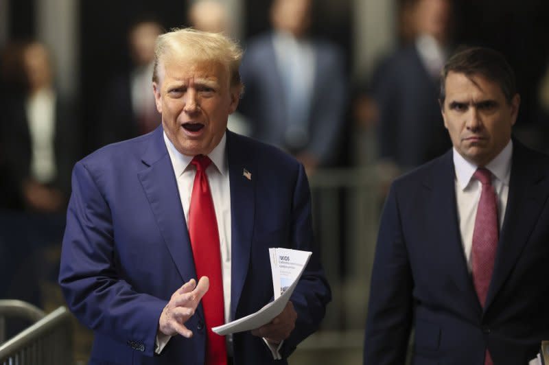 Former President Donald Trump speaks to reporters as he arrives for his trial at Manhattan criminal court in New York on Monday. Pool Photo by Brendan McDermid/UPI