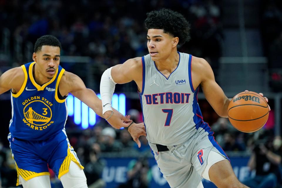 Detroit Pistons guard Killian Hayes (7) drives as Golden State Warriors guard Jordan Poole (3) defends during the first half Friday, Nov. 19, 2021, in Detroit.