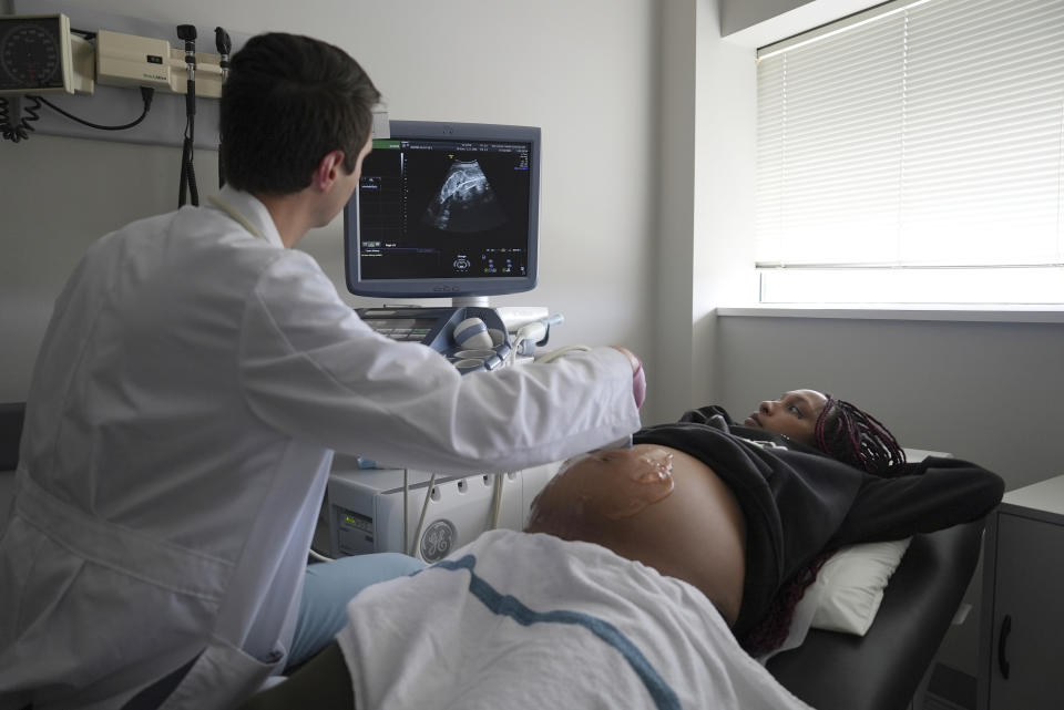 Areana Coles receives an ultrasound during a prenatal visit at the Oklahoma State University obstetrics and gynecology clinic in Tulsa, Okla., on Tuesday, July 16, 2024. (AP Photo/Mary Conlon)