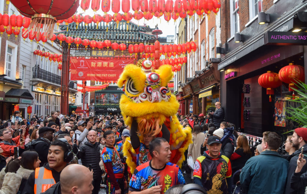 London's Chinatown is seen here adorned with red paper lanterns with dancers performing as part of ongoing Lunar New Year 2024 celebrations. <span class="copyright">Vuk Valcic— Getty Images</span>
