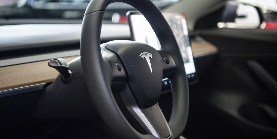 14 november 2018, north rhine westphalia, düsseldorf the logo can be seen on the steering wheel of tesla's model 3 electric car in a showroom tesla starts on 14112018 with the presentation of the car in europe photo christophe gateaudpa photo by christophe gateaupicture alliance via getty images