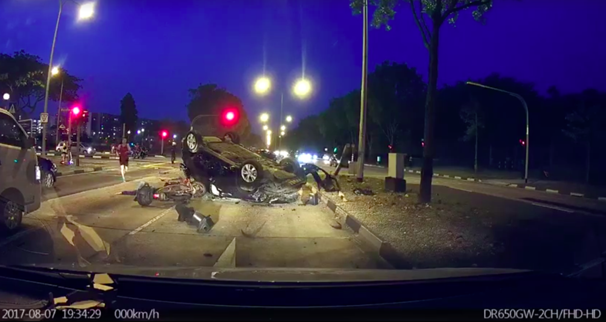 An accident on 7 August 2017 at the junction of Woodlands Ave 12 and Woodlands Ave 1 killed a motorcyclist. (Screengrab of video by Wai Yan Lu/Facebook)