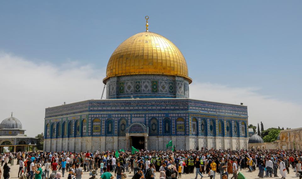 Supporters of the Palestinian Hamas movement gather during a rally to mark al-Quds (Jerusalem) day, following the last Friday prayers of the Muslim fasting month of Ramadan, outside the Dome of the Rock mosque at the al-Aqsa mosque compound, Islams third holiest site, in Jerusalem's old city, on May 7, 2021. (Ahmad Gharabli/AFP via Getty Images)