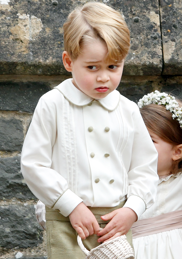 Prince George was pictured looking sheepish after being told off at Pippa's wedding. Photo: Getty