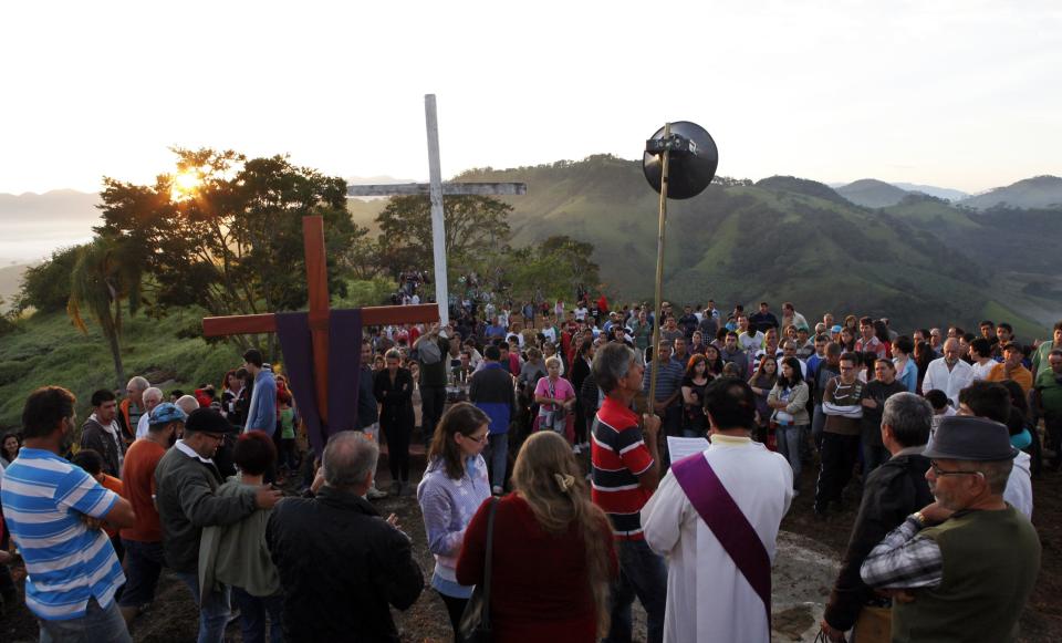 Catholic devotees attend a procession at the Cruzeiro mountain to mark Good Friday in Goncalves