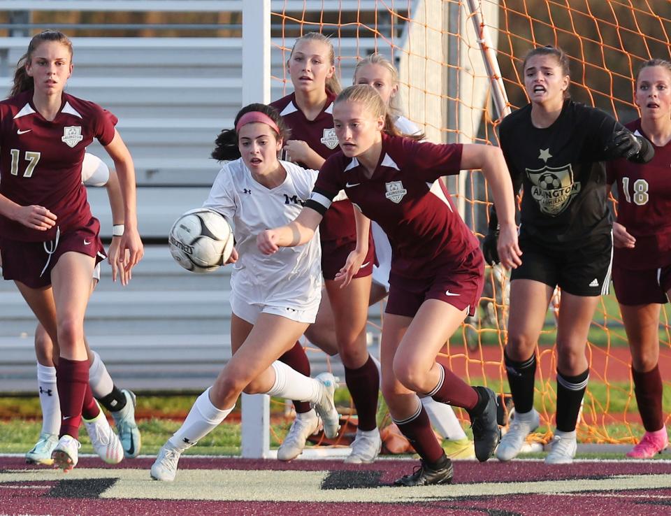 From right, Arlington's Madison Heitman (6) and Monroe-Woodbury's Francesca Donovan (7) battle for ball control during the girls soccer Class AA state regional semifinals at Arlington High School in Lagrangeville Nov. 1, 2022. Monroe-Woodbury won the game.