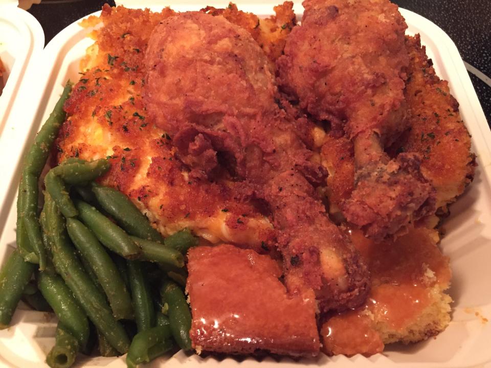 Fried chicken served with baked macaroni & cheese, cornbread and green beans from Harmony's Kitchen in Burlington, shown April 2, 2021.