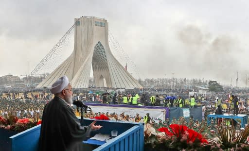 Iranian President Hassan Rouhani addresses crowds during a ceremony celebrating the 40th anniversary of the Islamic revolution on February 11, 2019