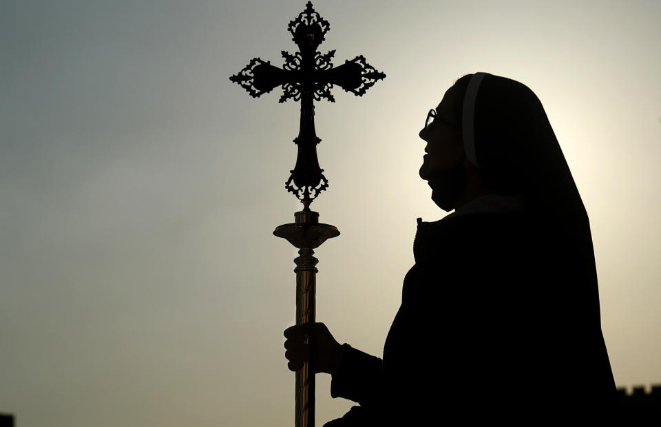 An Iraqi Christian is shown during preparations before Pope Francis visit at the main stadium in Irbil, Iraq, Saturday, March 6, 2021. Earlier today Pope Francis met privately with the country's revered Shiite leader, Grand Ayatollah Ali al-Sistani. (AP Photo/Hadi Mizban)