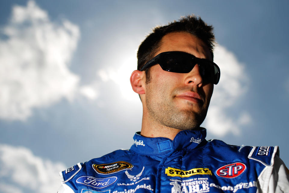 DAYTONA BEACH, FL - FEBRUARY 19: Aric Almirola, driver of the #43 Smithfield Ford, looks on after qualifying for the NASCAR Sprint Cup Series Daytona 500 at Daytona International Speedway on February 19, 2012 in Daytona Beach, Florida. (Photo by Tom Pennington/Getty Images for NASCAR)