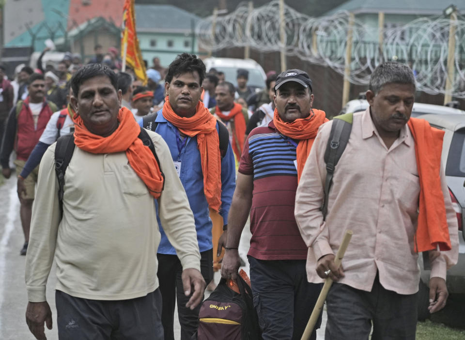 Hindu devotees leave for the Amarnath Yatra annual pilgrimage to to an icy Himalayan cave, in Nunwun, Pahalgam, south of Srinagar, Indian-controlled Kashmir, Thursday, June 30, 2022. Officials say pilgrims face heightened threat of attacks from rebels fighting against Indian rule and have for the first time tagged devotees with wireless tracking system. They also have deployed drones for surveillance. (AP Photo)