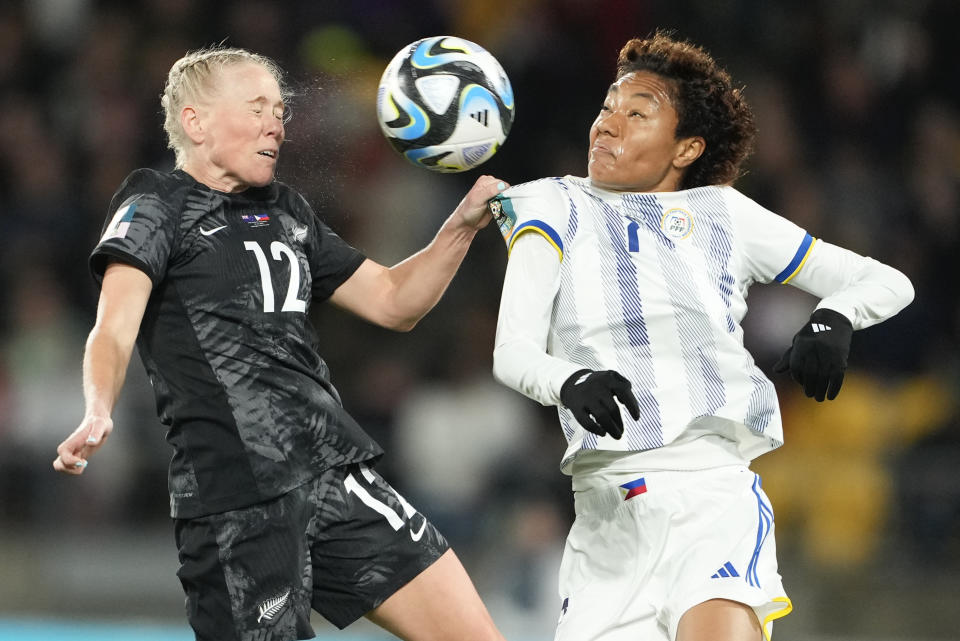New Zealand's Betsy Hassett, left, and Philippines' Sarina Bolden compete to head the ball during the Women's World Cup Group A soccer match between New Zealand and the Philippines in Wellington, New Zealand, Tuesday, July 25, 2023. (AP Photo/John Cowpland)
