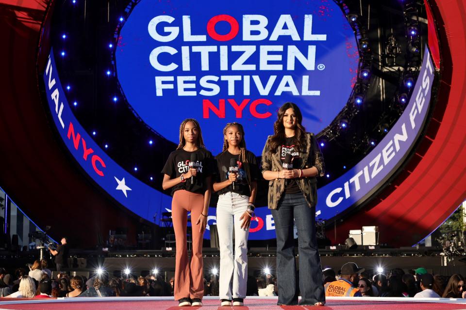 Twin sisters Brooke and Breanna Bennett and Miss Universe Harnaaz Sandhu address the Global Citizen Festival on Sept. 24, 2022, in New York City.
