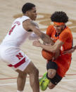 Nebraska guard Shamiel Stevenson (4) reaches in for the ball against Illinois' Andre Curbelo (5) during the first half of an NCAA college basketball game on Friday, Feb. 12, 2021, in Lincoln, Neb. (Francis Gardler/Lincoln Journal Star via AP)