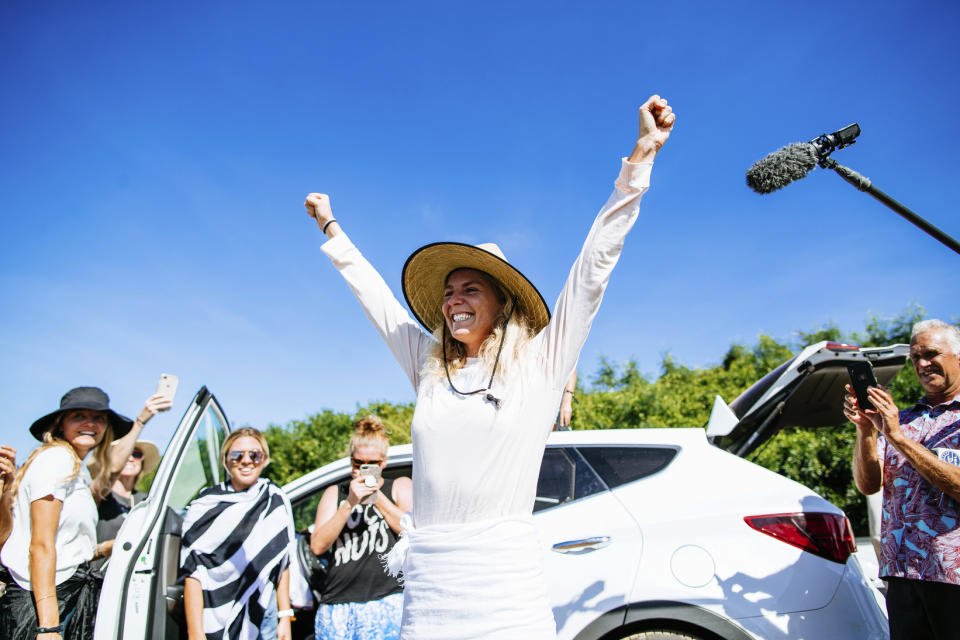 In this 2018 photo, Stephanie Gilmore of Australia celebrates winning the World Title at the Beachwaver Maui Pro, in Honolua, Hawaii. If Gilmore wins the gold medal when surfing makes its Olympic debut next year, it might be considered a very nice bonus. Now in the conversation as the greatest of all time on the women’s side in her sport, Gilmore successfully fought for another prize, equal pay for the women, on the professional tour where she and the rest of her rivals make their living. (Ed Sloane/World Surf League via AP)