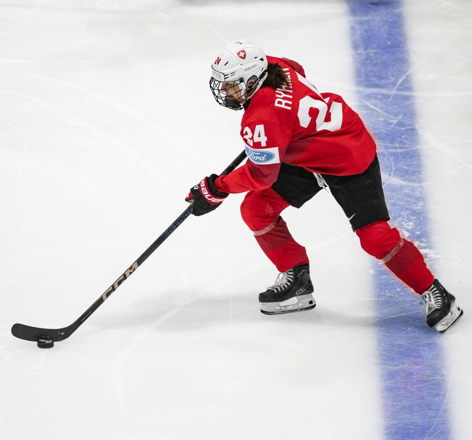 Switzerland's Noemi Ryhner advances the puck at the Adirondack Bank Center in Utica, NY on Friday, April 5, 2024.