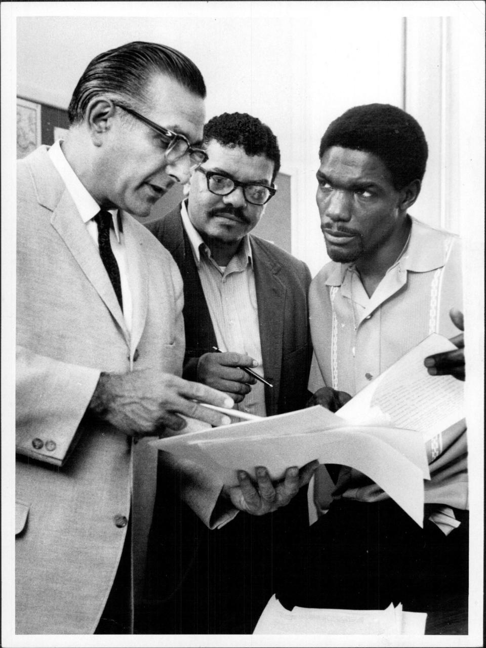 Rochester Schools Superintendent Herman Goldberg, left, with Richard Harrison, center, and Reecy Davis, of the United Federation of Inner-City Parents, in 1969, working on district plans for racial integration. Goldberg was a Jew who played baseball in the 1932 Olympics in Berlin in Nazi Germany.