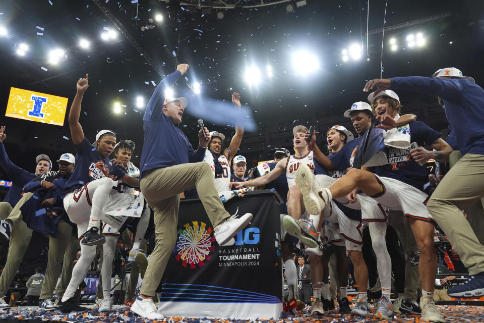 Illinois players and coaches celebrate after their win over Wisconsin of an NCAA college basketball game in the championship of the Big Ten Conference tournament, Sunday, March 17, 2024, in Minneapolis. (AP Photo/Abbie Parr)