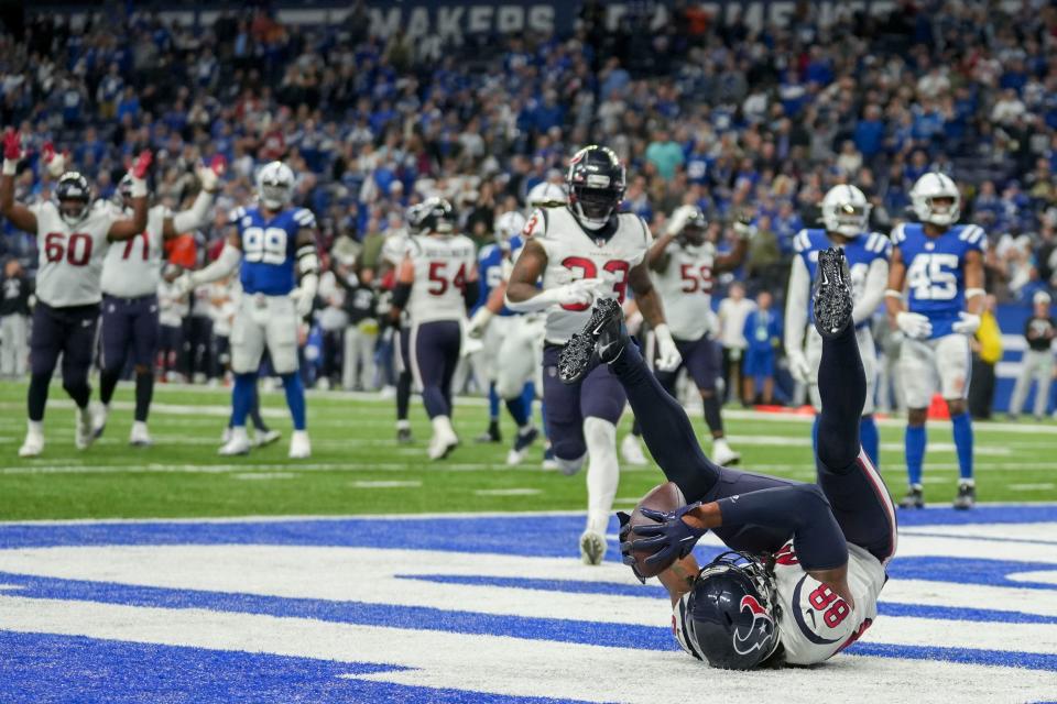 Houston Texans tight end Jordan Akins (88) rolls in the end zone after making a catch for a 2-point conversion Jan. 8 against the Indianapolis Colts in Indianapolis.