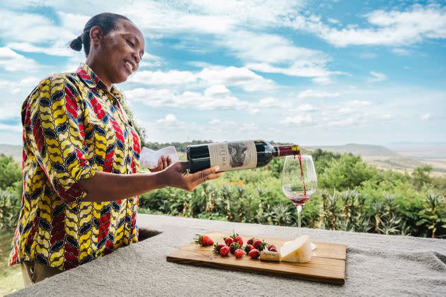 <p>Courtesy of Angama</p> Pouring a Bordeauxstyle South African red at Kenya’s Angama Mara