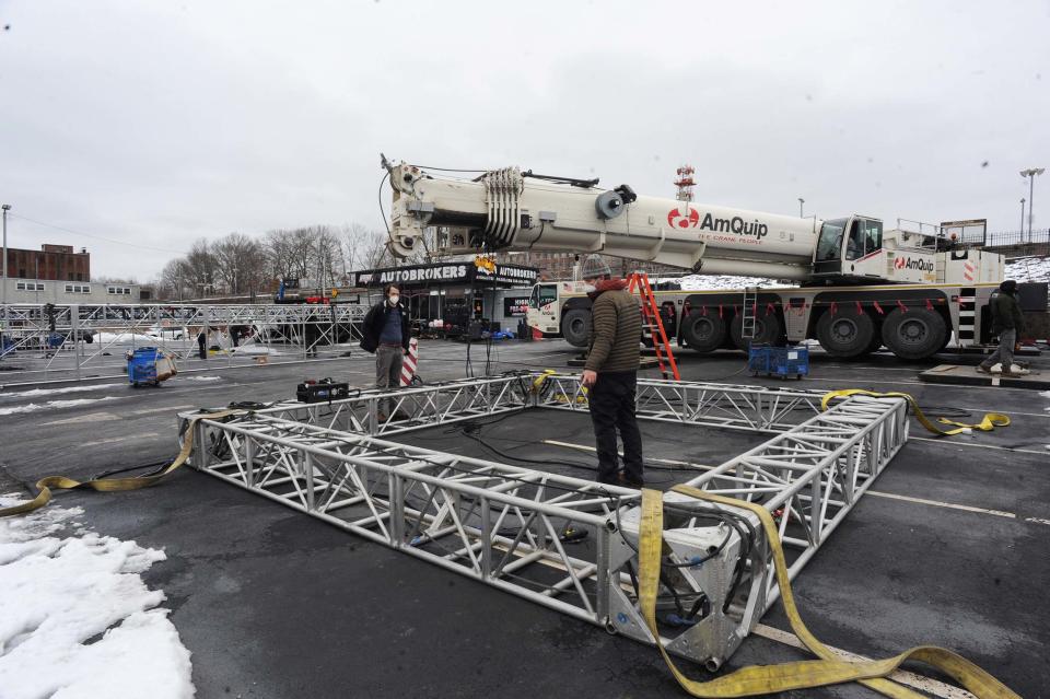Crews set up equipment in the parking lot of Avon Auto Brokers on Montello Street, next to the former D'Angelo Grilled Sandwiches location, which was turned into "Burger Crown." Preparations are underway in downtown Brockton for the filming this week of Netflix's movie "Don't Look Up."