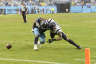 Tennessee Titans running back Dontrell Hilliard, left, fumbles the ball as he is hit by Houston Texans outside linebacker Zach Cunningham (41) in the second half of an NFL football game Sunday, Nov. 21, 2021, in Nashville, Tenn. Titans tight end Anthony Firkser recovered the ball in the end zone for a touchdown. (AP Photo/Mark Zaleski)
