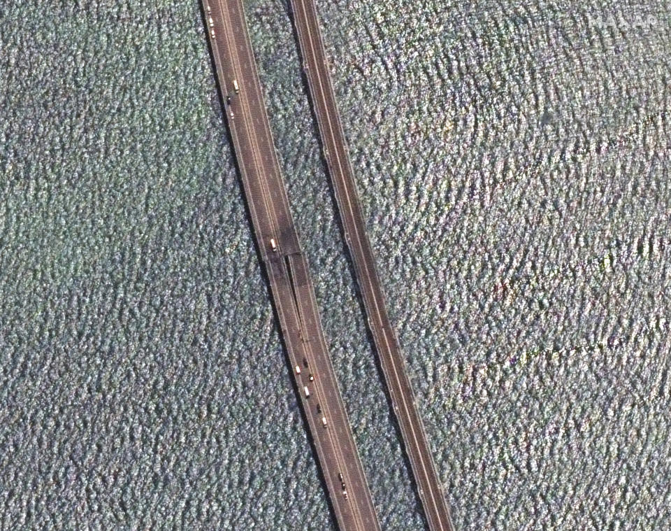 This image provided by Maxar Technologies, shows damaged parts of an automobile link of the Crimean Bridge connecting Russian mainland and Crimean peninsula over the Kerch Strait not far from Kerch, Crimea on Monday, July 17, 2023. (Satellite image ©2023 Maxar Technologies via AP)