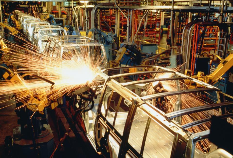 Robots welding automobile van bodies on an assembly line, Baltimore, Maryland, USA
