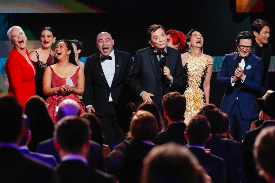 Star James Hong, center, cracks up his "Everything Everywhere All at Once" cast mates at the Screen Actors Guild awards.
