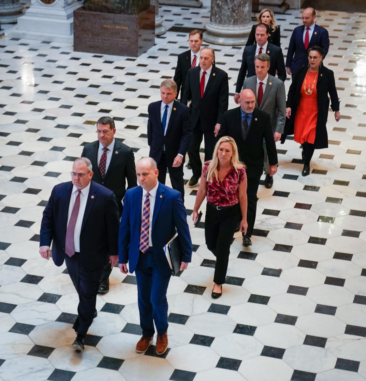 House Republican impeachment managers, including Rep. Marjorie Taylor Greene (R-GA), walk through National Statuary Hall delivering the article of impeachment against Department of Homeland Security Secretary Alejandro Mayorkas, President Joe Biden's top border security official, at the Capitol, April 16, 2024.