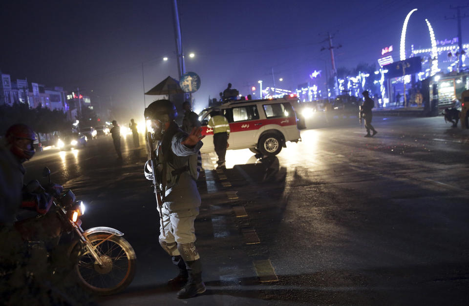 Security forces block the roads at the site of a suicide attack in Kabul, Afghanistan, Nov. 20, 2018. (AP Photo/Massoud Hossaini)