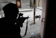 <p>Mideast crisis Iraq Mosul: An Iraqi Special Forces soldier some moments after shooting dead a suspected suicide bomber, during the offensive to retake Mosul, March 3, 2017.<br>The battle to reclaim Mosul from ISIS began in October 2016 and lasted until July 2017, with fighting against pockets of ISIS militants continuing in some quarters of the city even beyond that date. The use of suicide bombers was a common tactic by the militants. (Photo: Goran Tomasevic/Reuters) </p>