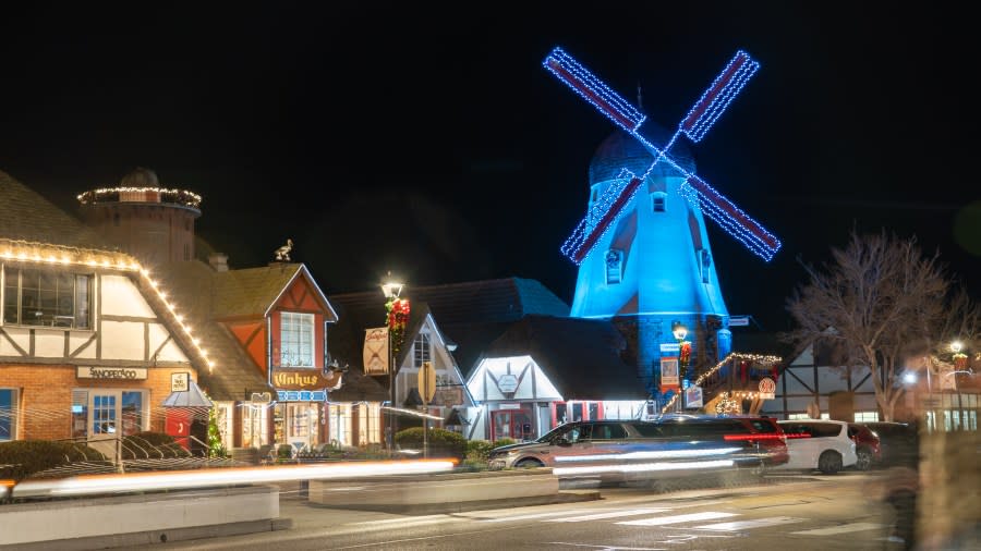 One of Solvang's iconic windmills is seen lit up in blue during the town's annual Julefest celebration in 2022. (Mike Laan/City of Solvang)