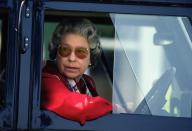 <p>At the wheel of a Land Rover, the Queen sported large sunglasses.</p>