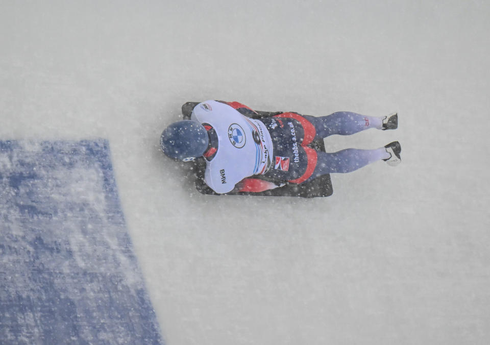 Matt Weston, of Britain, takes a turn during the first run of the men's skeleton World Cup race on Friday, Dec. 16, 2022, in Lake Placid, N.Y. Weston won the event. (AP Photo/Hans Pennink)