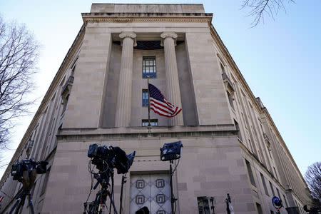 Television cameras stand in front of the Department of Justice the day after Special Counsel Robert Mueller delivered his report into Russia's role in the 2016 U.S. election and any potential wrongdoing by President Donald Trump in Washington, U.S., March 23, 2019. REUTERS/Joshua Roberts