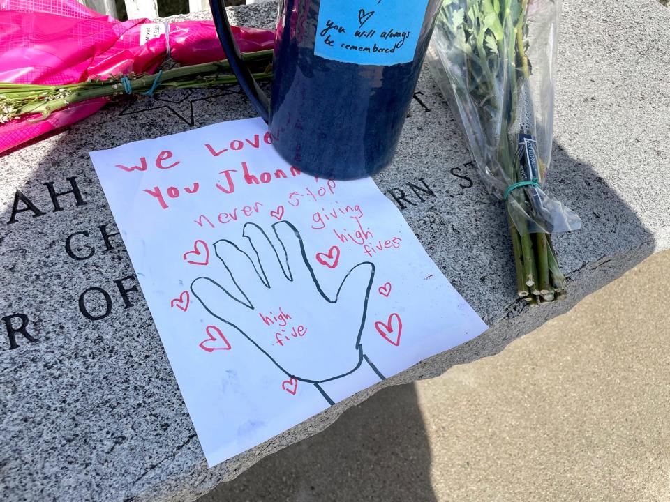 South Berwick resident John Nason died from a medical emergency while sitting on his favorite bench in the center of town Wednesday, March 13, 2024. The following day, flowers and notes are seen left in his memory.