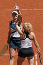 Czech Republic's Barbora Krejcikova, left, and compatriot Katerina Siniakova clap hands after defeating USA's Bethanie Mattek-Sands and Poland's Iga Swiatek during their women's doubles final match of the French Open tennis tournament at the Roland Garros stadium Sunday, June 13, 2021 in Paris. (AP Photo/Thibault Camus)