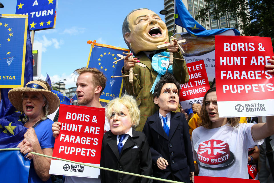 A stilts-walker wearing a giant Nigel Farage's head pulling two puppets, the Conservative leadership candidates Boris Johnson and Jeremy Hunt, during the �No to Boris. Yes to Europe� march in central London. (Photo by Dinendra Haria / SOPA Images/Sipa USA)