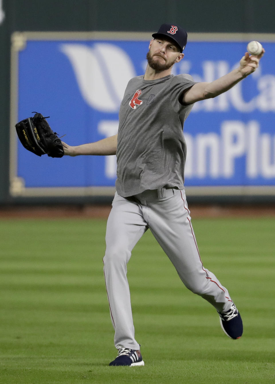 Boston Red Sox starting pitcher Chris Sale warms up during batting practice before Game 4 of a baseball American League Championship Series against the Houston Astros on Wednesday, Oct. 17, 2018, in Houston. (AP Photo/Frank Franklin II)