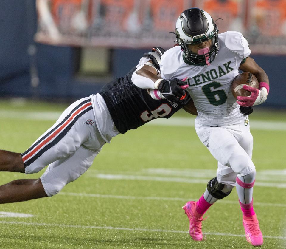 GlenOak's Avantae Burt runs the ball at McKinley, Friday, Oct. 13, 2023.