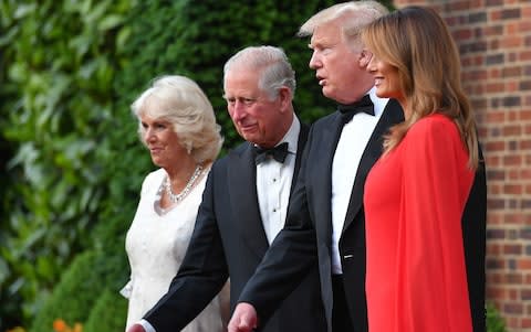 US President Donald Trump (2R) and US First Lady Melania Trump (R) greet Britain's Prince Charles, Prince of Wales (2L), his wife Britain's Camilla, Duchess of Cornwall, ahead of a dinner at Winfield House - Credit: MANDEL NGAN / AFP
