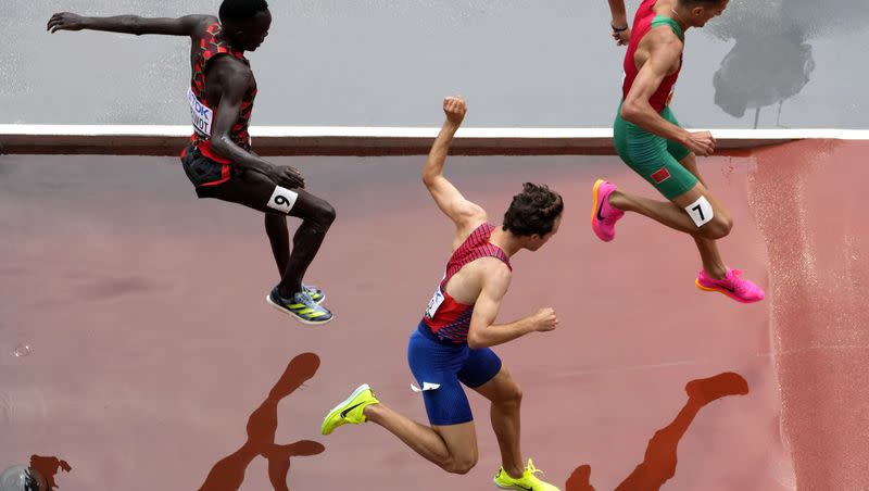 Abraham Kibiwot, of Kenya, Kenneth Rooks, center, of the United States, and Soufiane El Bakkali (7), of Morocco, compete in a Men’s 3,000-meter steeplechase qualifying heat at the World Athletics Championships in Budapest, Hungary, Saturday, Aug. 19, 2023.