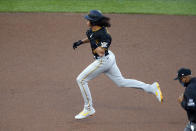 Pittsburgh Pirates' Cole Tucker rounds the bases on a solo home run off Minnesota Twins pitcher Lewis Thorpe in the first inning of a baseball game Monday, Aug. 3, 2020, in Minneapolis. (AP Photo/Jim Mone)