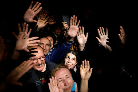 FILE PHOTO: Christian worshippers react as they take part in the Christian Orthodox Holy Fire ceremony at the Church of the Holy Sepulchre in Jerusalem's Old City, April 15, 2017. REUTERS/Amir Cohen/File Photo