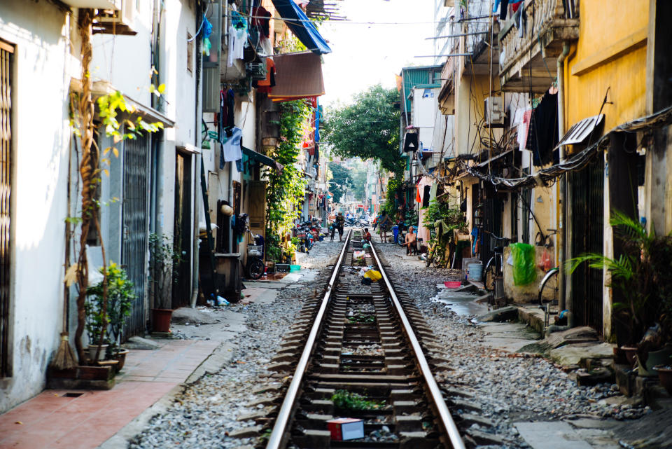 A street with a railroad in Asia.