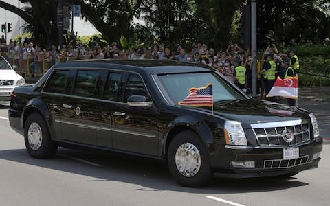 Mr Trump heading to the summit in 'The Beast' - Credit: AP